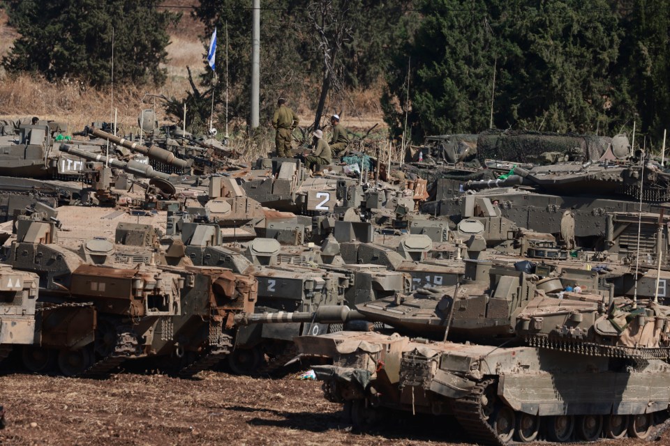 Israeli army tanks in the Upper Galilee region of northern Israel near the border with Lebanon