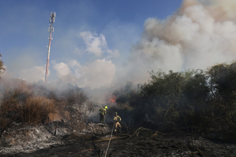 Responders put out a fire in the area of Lod, near Tel Aviv