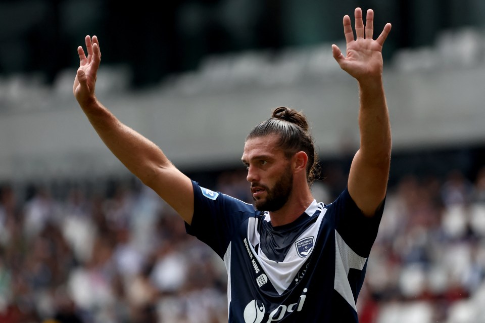 a soccer player wearing a blue and white jersey with the word odi on it