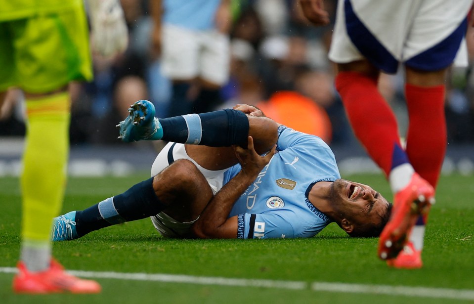 a man in a city jersey is laying on the ground