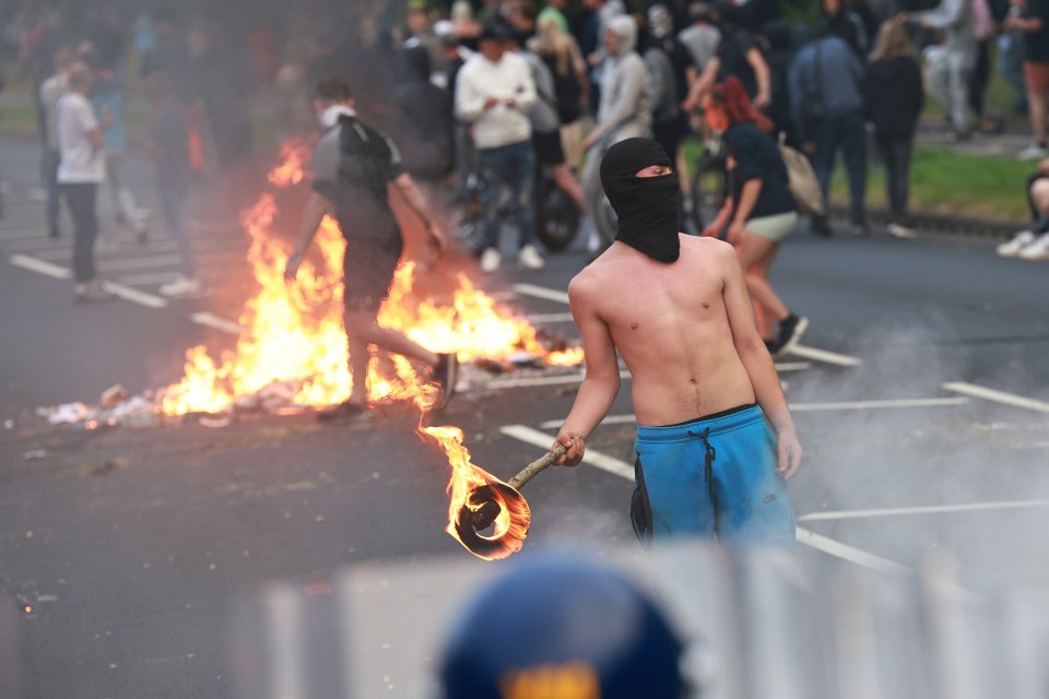 A balaclava-wearing rioter in Rotherham