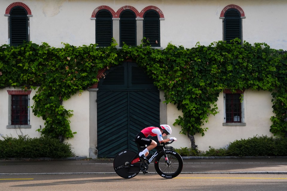 a person riding a bike with the word bmc on the front