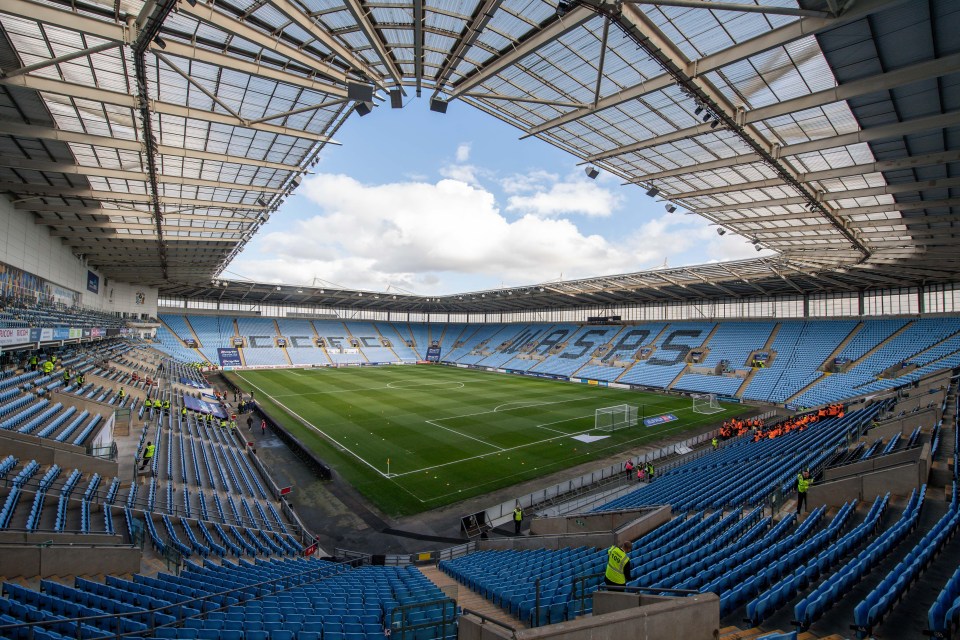 an empty soccer stadium with the word wasps on the side