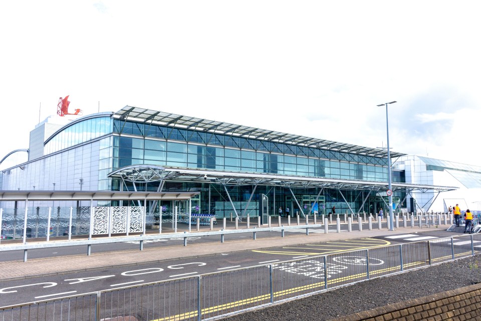 a large building with a red eagle on top of it