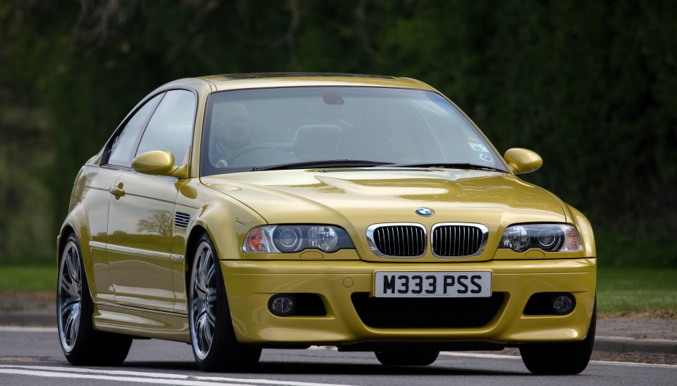 A BMW M3 car travelling on an English country road