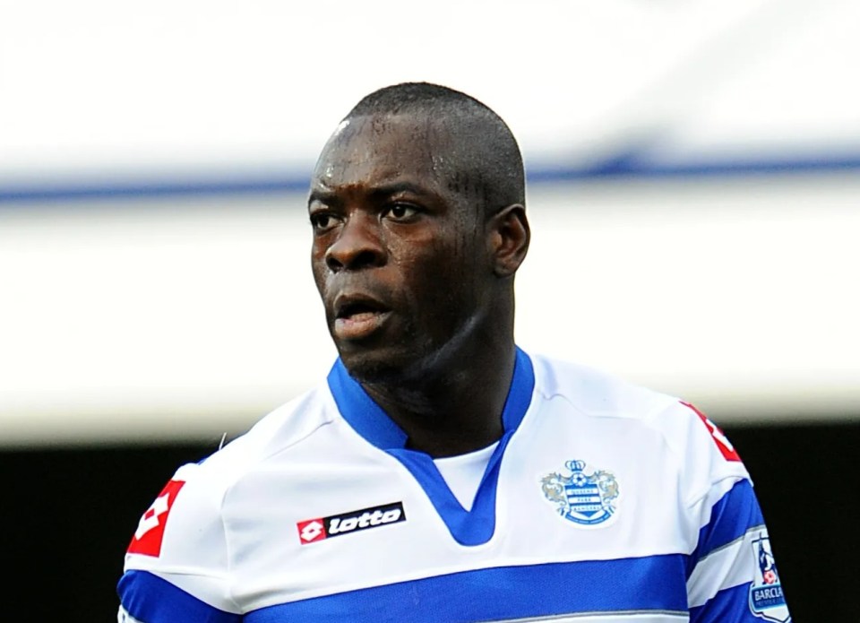 a soccer player wearing a blue and white air asia jersey