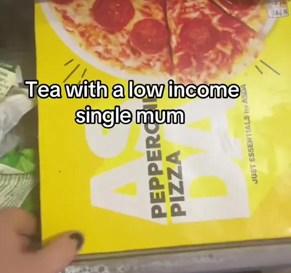 The tea consisted of a frozen pizza, as well as slices of garlic bread