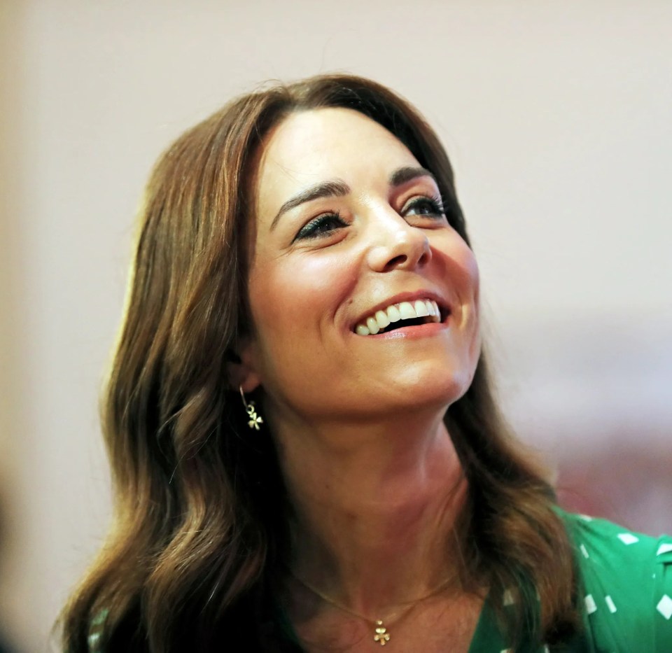 Kate in Galway, Ireland wearing Drapers earrings and necklace featuring small shamrocks