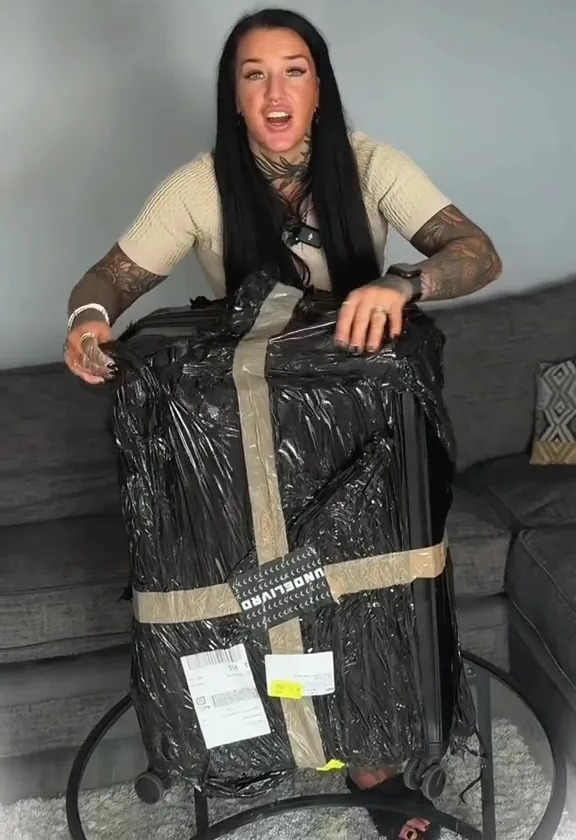 a woman is holding a suitcase wrapped in plastic and says this is the third and final