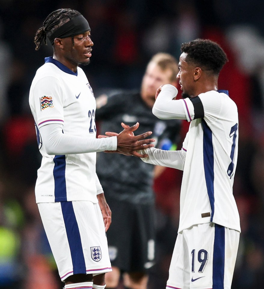 two soccer players one with the number 19 on his jersey