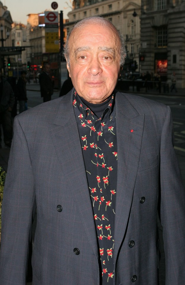 a man wearing a suit and a shirt with flowers on it