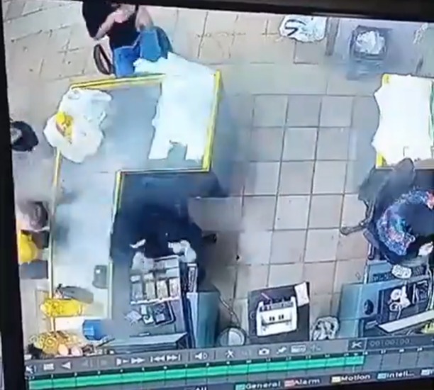 a security camera shows a man standing in a restaurant .