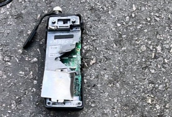 A damaged device discarded on the ground