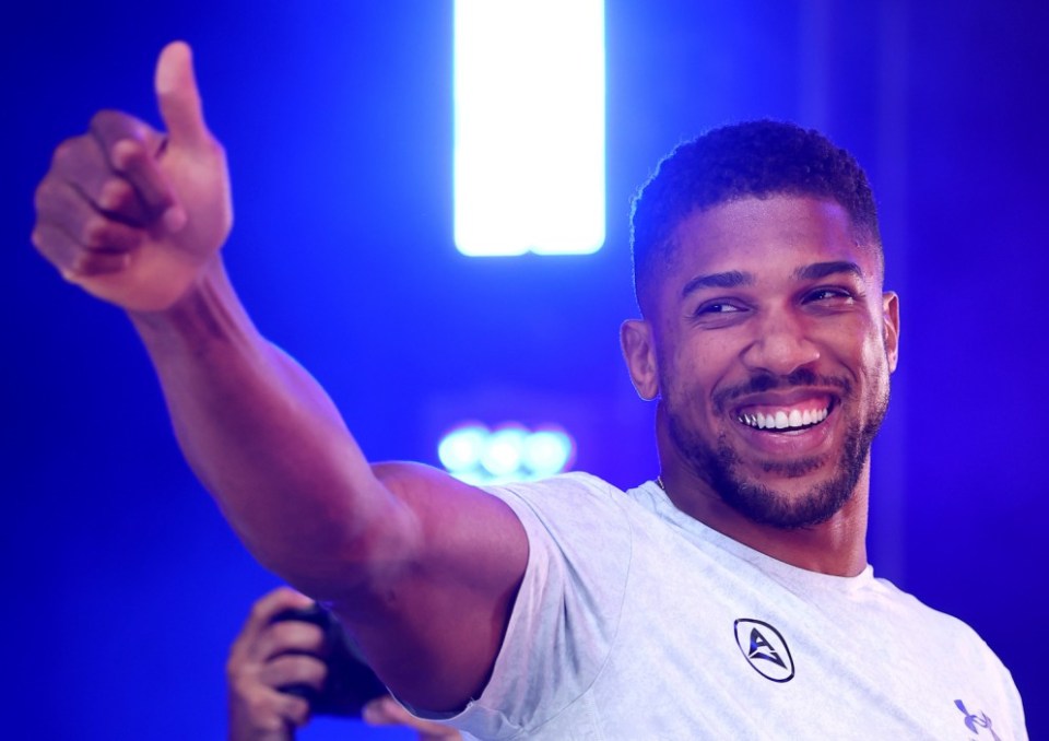 LONDON, ENGLAND - SEPTEMBER 20: Anthony Joshua gestures to the crowd during a weigh-in as part of the Riyadh Season - Wembley Edition card at Trafalgar Square on September 20, 2024 in London, England. (Photo by Richard Pelham/Getty Images)