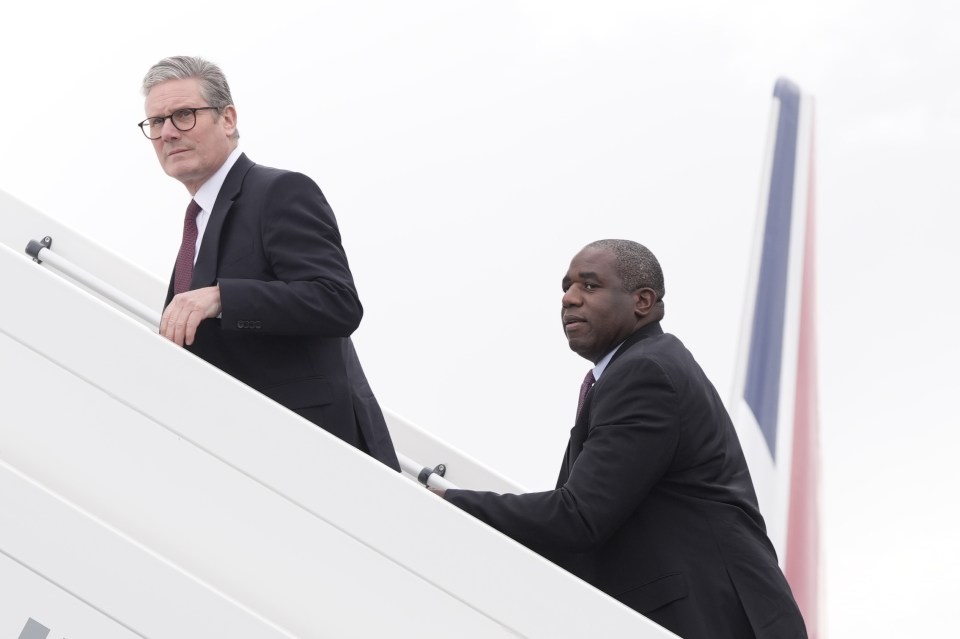 Prime Minister Sir Keir Starmer (left) and Foreign Secretary David Lammy board a plane as they depart from Stansted airport in Essex, to travel to Washington DC on Thursday