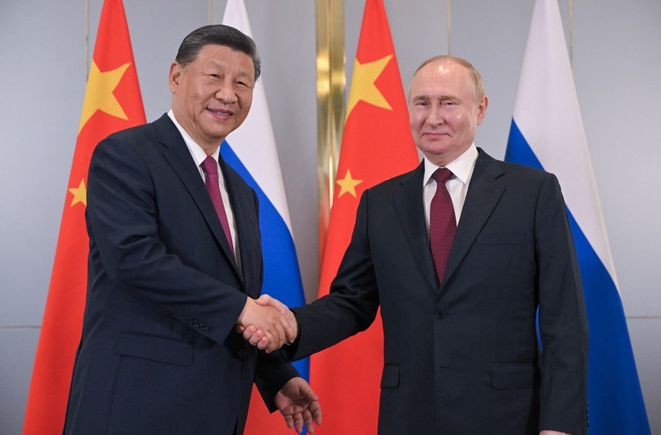 In this pool photograph distributed by the Russian state agency Sputnik, Russia's President Vladimir Putin meets with China's President Xi Jinping on the sidelines of the Shanghai Cooperation Organisation (SCO) member states leaders' summit in Astana on July 3, 2024. (Photo by Sergei GUNEYEV / POOL / AFP) (Photo by SERGEI GUNEYEV/POOL/AFP via Getty Images)