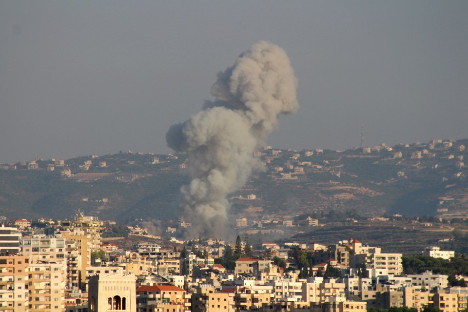 Smoke billows after an Israeli airstrike that targeted the southern Lebanese village of Abbasiyeh