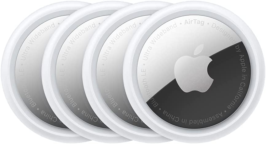 four apple airtags are lined up in a row