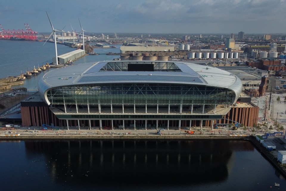 an aerial view of a large stadium in a city