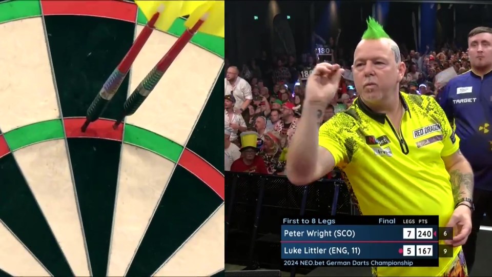 a man with a green mohawk is playing darts