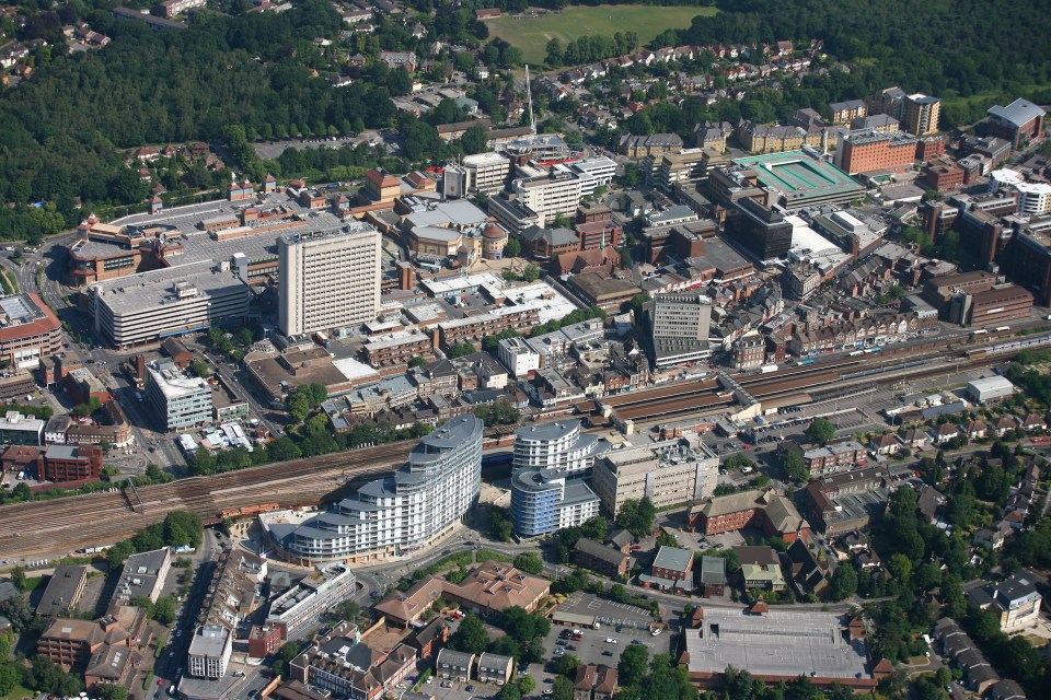 an aerial view of a city with lots of buildings and trees