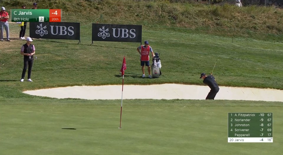 a golf course with a sign that says ubs on it