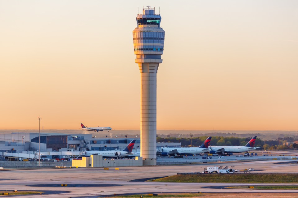 a delta airlines plane is taking off from an airport