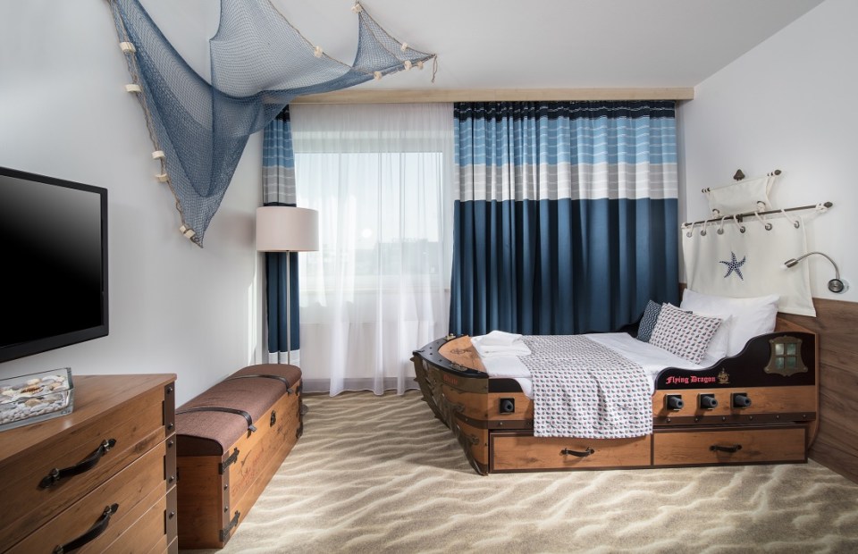 a bedroom with a bed that looks like a pirate ship