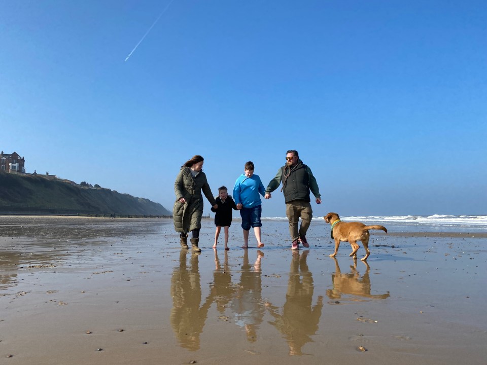 Mum Katie and dad Tim with sons Albie and Owen and dog Myrtle