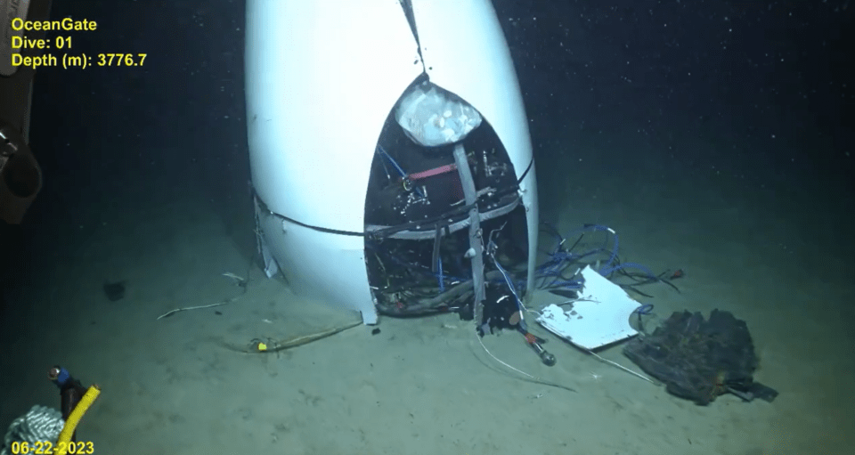 Footage shows the sub wreck on the ocean floor with cables poking out