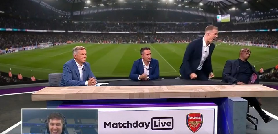 four men sit at a table with a sign that says matchday live