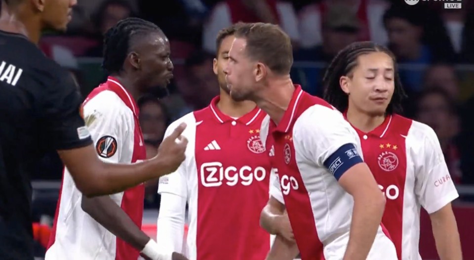 Jordan Henderson and Bertrand Traore clash during Ajax's win over Besiktas