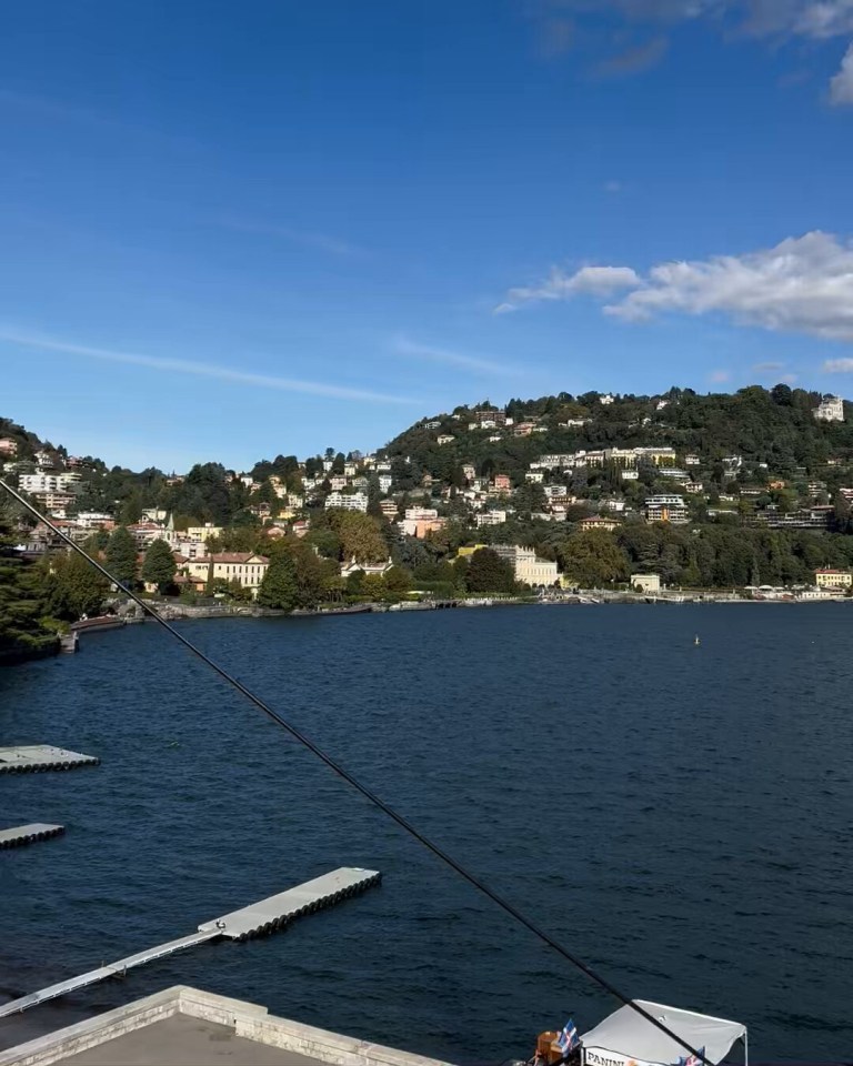 a large body of water with a city in the background