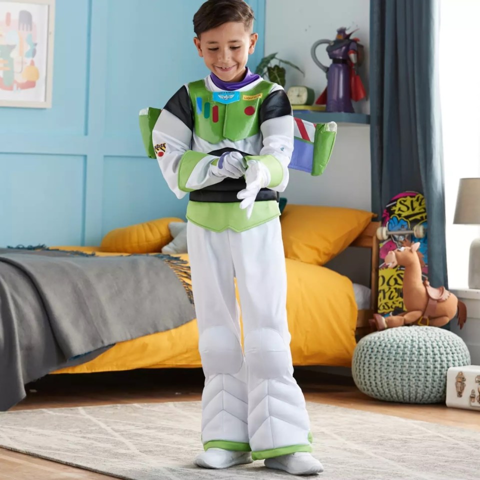 a young boy in a toy story buzz lightyear costume