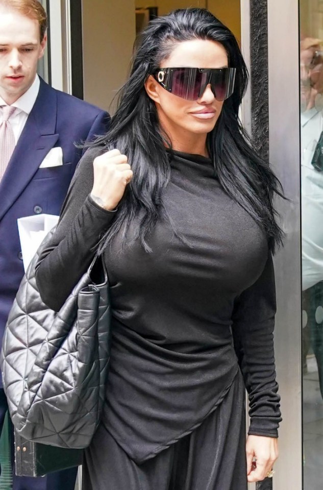 Katie Price leaves at The High Court after a bankruptcy hearing Central London . ..