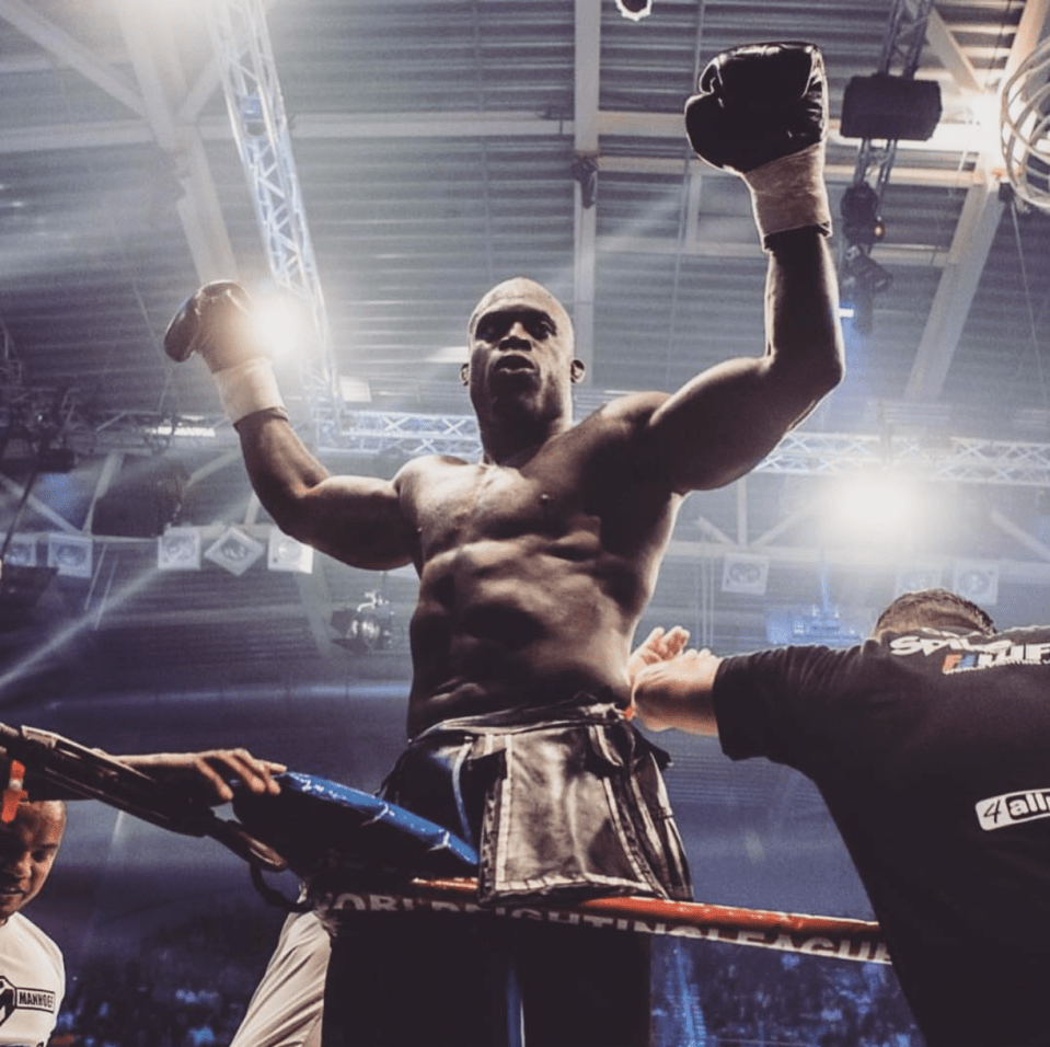 a man in a boxing ring with the word league on it