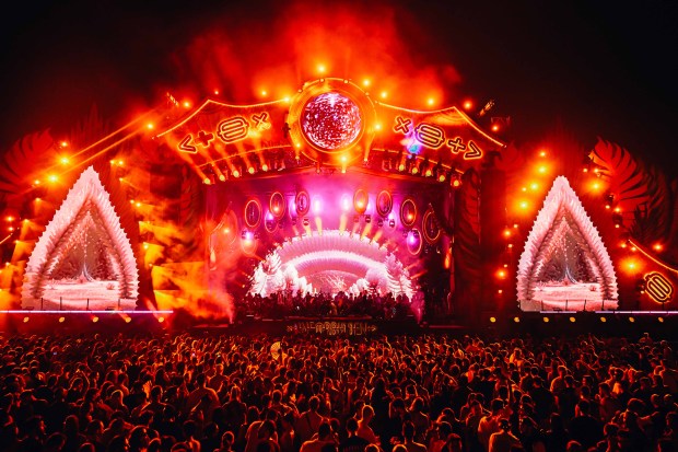 a crowd of people at a concert with a stage that says hex on it