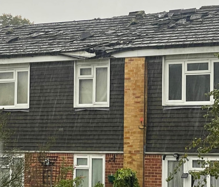 a house with a roof that has been damaged by a storm