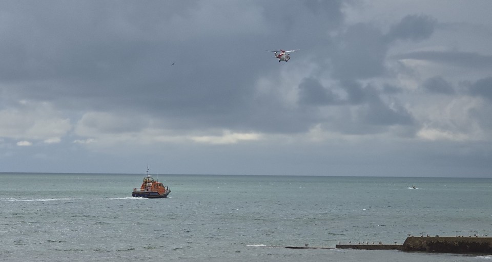 A coastguard boat and helicopter off the Isle of Wight