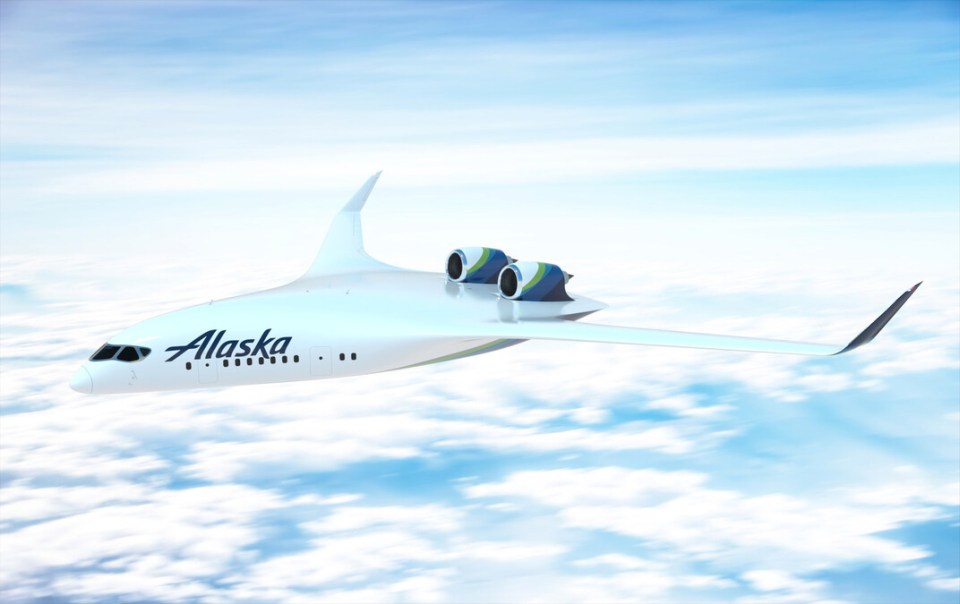 a white alaska airplane is flying in the sky