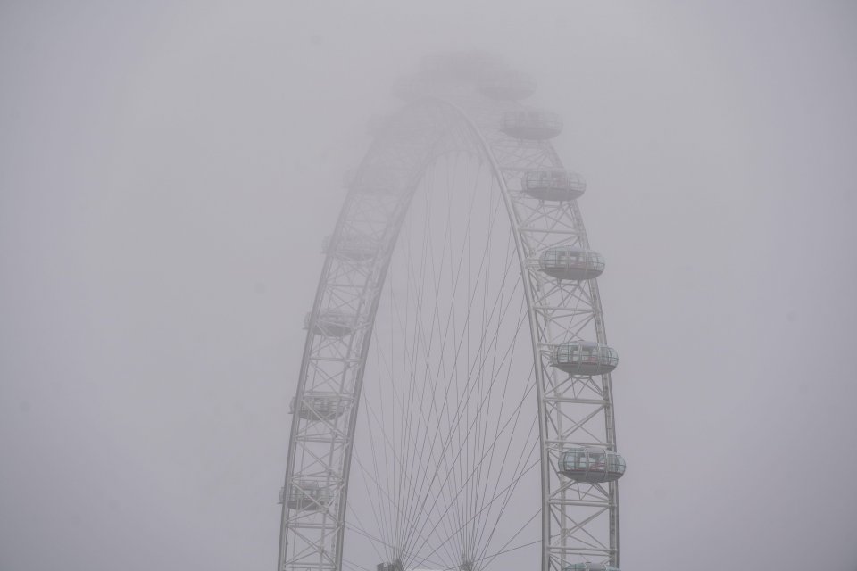 The London Eye shrouded in fog this morning