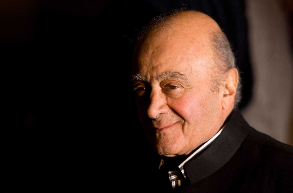 a close up of a man 's face with a black background