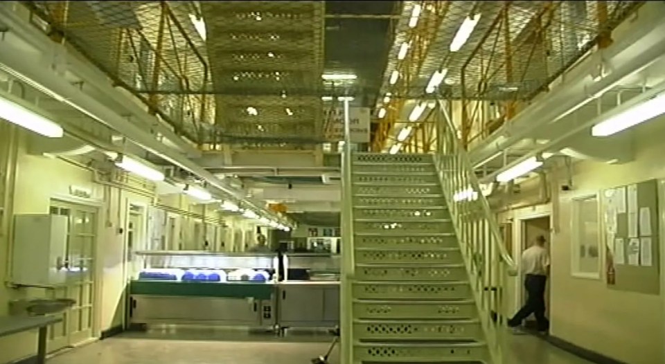 a staircase in a building with a sign that says ' prison ' on it