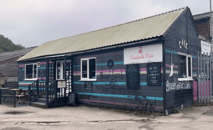 a building with a sign that says breakfast cafe