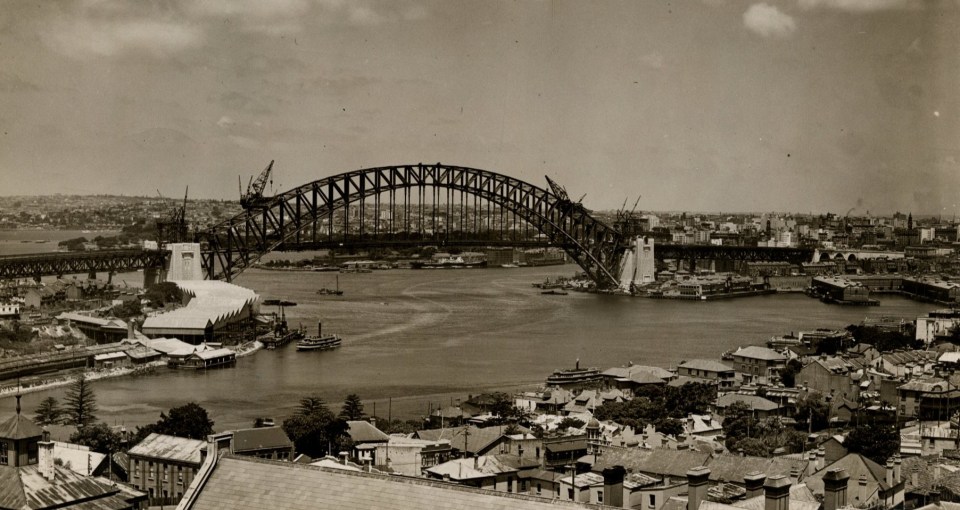 Caption: The two halves of Sydney Harbour Bridge were joined together on this day in 1930. It was opened in 1932