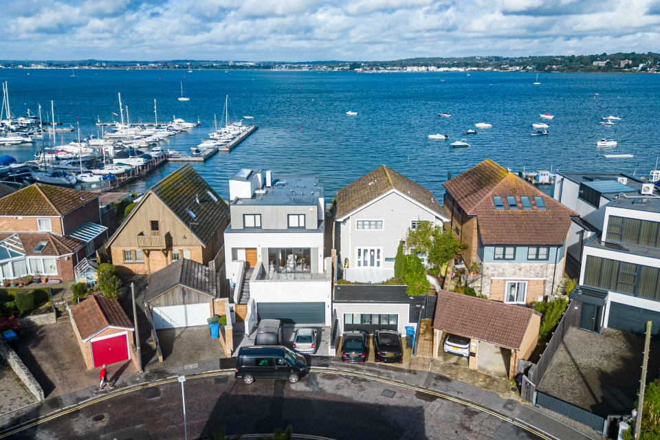 The properties have rear gardens which back onto the water and have panoramic views over Poole Harbour