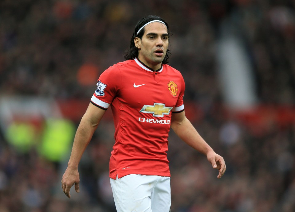 a soccer player wearing a red chevrolet jersey