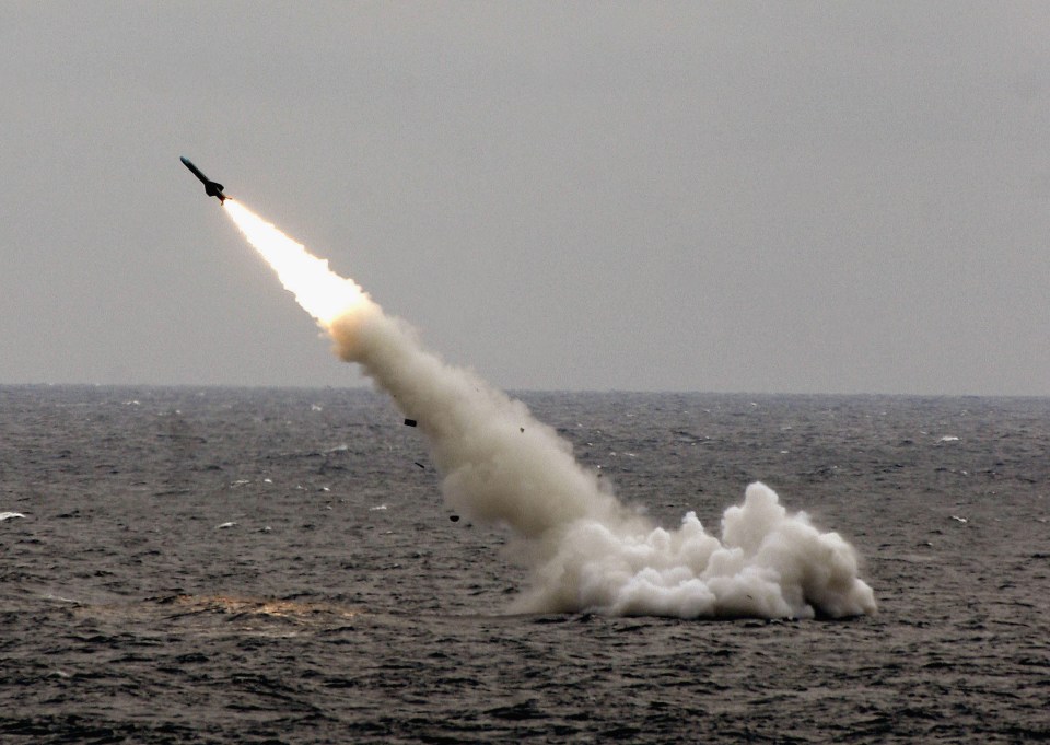 a rocket is being launched into the ocean