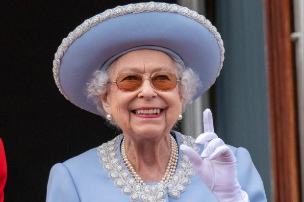 queen elizabeth wearing a blue hat and white gloves