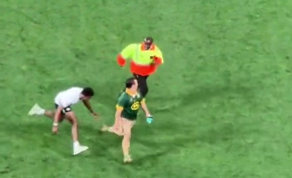 A member of security wasn't going to let the pitch invader carry on